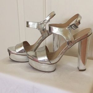 Platform silver sandals with 5 inch heel.